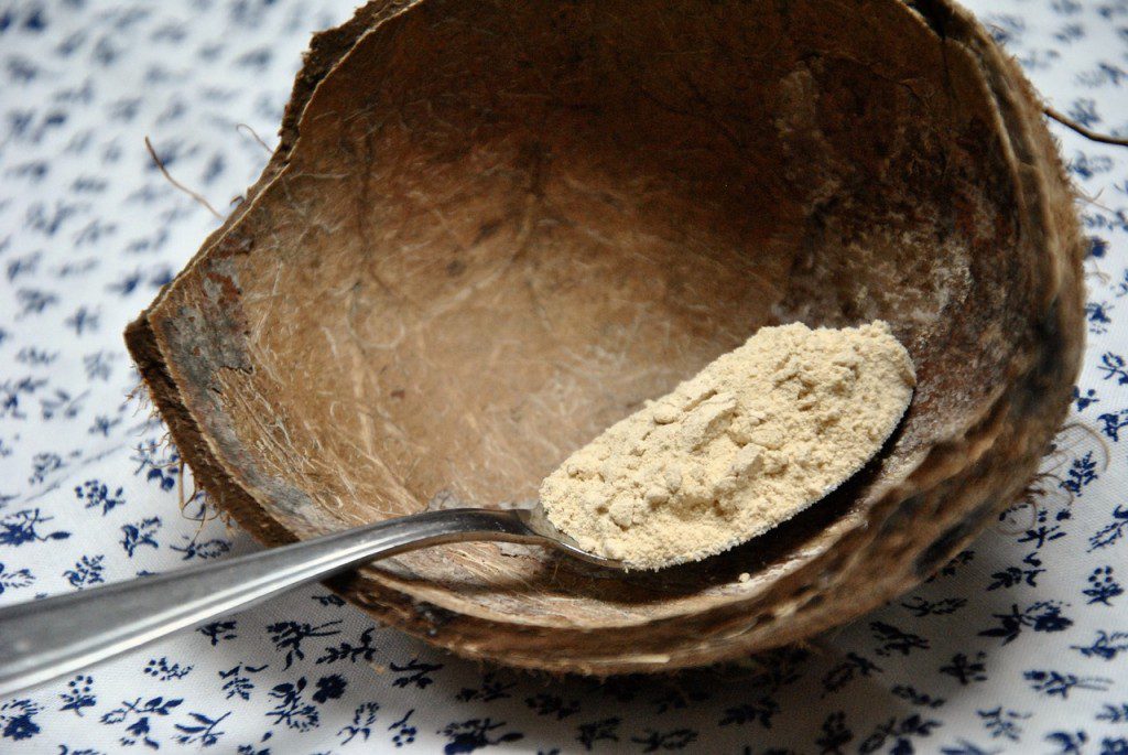 natural aphrodisiac maca powder on a spoon