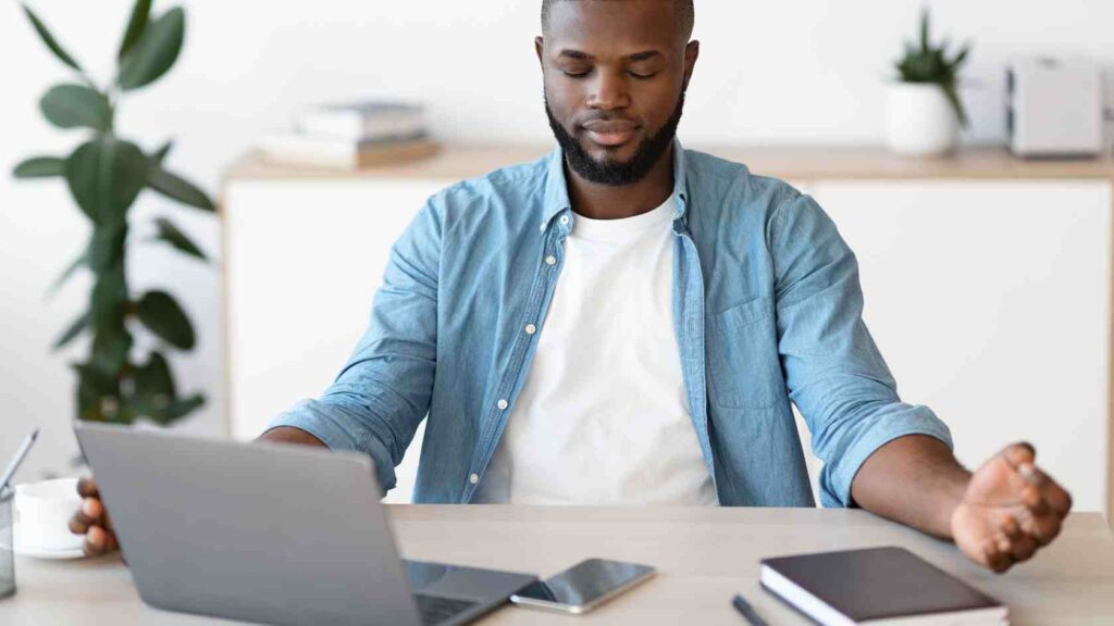 Man Practicing Mindful Self-Compassion During Work.jpg