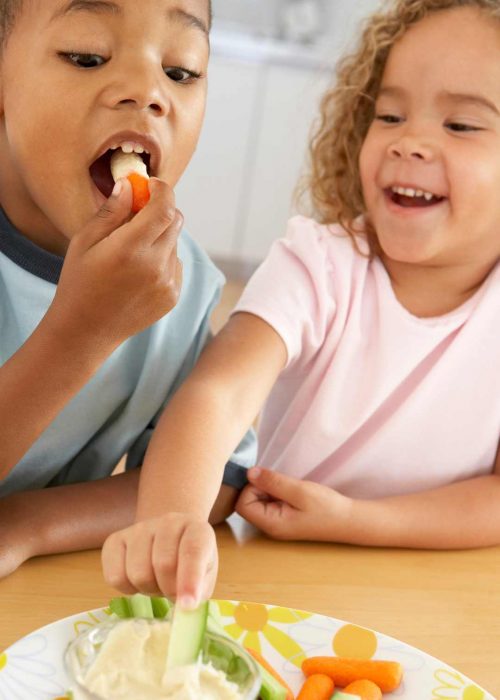 Smart Eating For Infants & Children Header – kids eating Childhood Nutrition: Kids Enjoying Vegetable Sticks